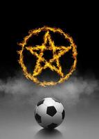 Soccer ball and ring of fire in black smoke background photo