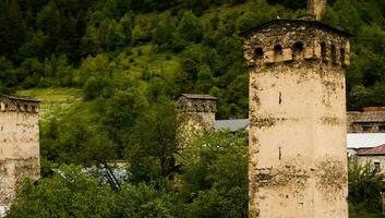 Svaneti. Svan towers in Mestia Svaneti region of Georgia. Ancient stony tower photo