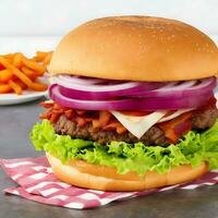 Free photo big sandwich - hamburger burger with beef, red onion, tomato and fried bacon