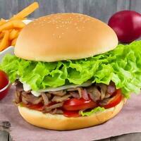 Free photo big sandwich - hamburger burger with beef, red onion, tomato and fried bacon