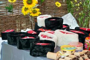 Cossack caps on the counter. Traditional Cossack clothes photo