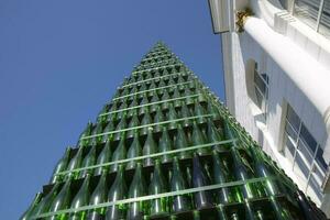 Christmas tree of bottles of champagne. Creative from bottles. Empty bottles of champagne photo