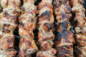 Generative AI illustration of skewered shish kebab, Kebabs - grilled meat  skewers, vegetables on black wooden background. Meat skewers in a barbecue  22922899 Stock Photo at Vecteezy