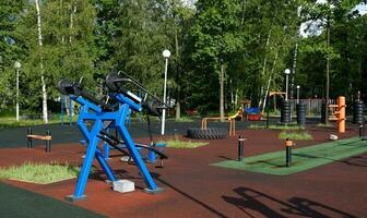 Urban sports ground with weight training and exercise equipment for sports. Sports and recreation area. Empty sports ground outdoor workout in a park. photo