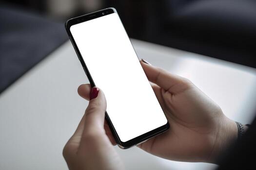 Woman holding smartphone with blank white screen. Smartphone mock up. Empty, copy space for app, game, website presentation. Empty mobile phone screen ready for your design. . photo