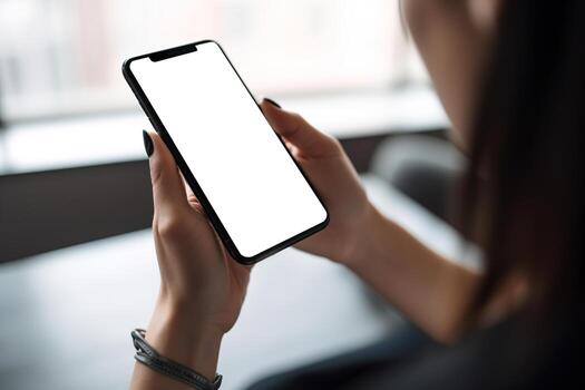 Woman holding smartphone with blank white screen. Smartphone mock up. Empty, copy space for app, game, website presentation. Empty mobile phone screen ready for your design. . photo
