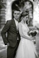 newlyweds walk in the city near old buildings photo