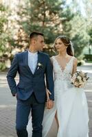 newlyweds walk in the city near old buildings photo