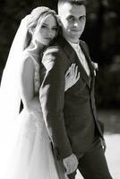 newlyweds walk in the city near old buildings photo