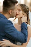 newlyweds walk in the city near old buildings photo