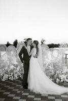 bride and groom against the backdrop of a yellow sunset photo