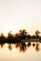 river in the orange sunset light photo