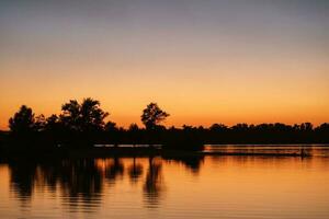 river in the orange sunset light photo