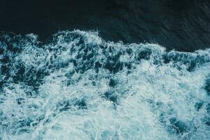 View from above turquoise ocean waves background. photo