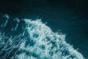 View from above turquoise ocean waves background. photo