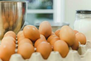 Fresh chicken egg with Ingredients for baking on the table. photo