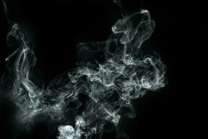 Abstract  powder or smoke isolated on black background photo