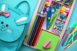 Stylish colored stationery.  Workplace. Organization of a drawer at the workplace. Storage and order of office supplies. Concept back to school. photo