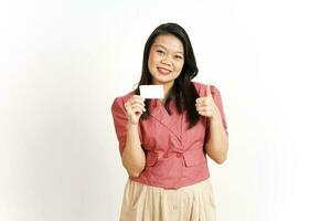 Holding and Showing Blank Credit Card Of Beautiful Asian Woman Isolated On White Background photo