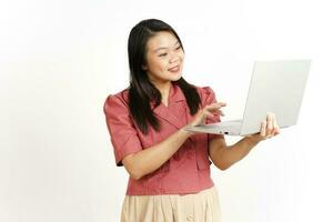 Standing and Working With Laptop Of Beautiful Asian Woman Isolated On White Background photo