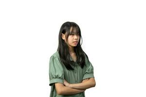 Asian girl in green shirt standing with arms crossed white background photo