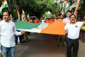 Delhi, India -15 June 2023 - Large group of people during big Tiranga Yatra organized as part of the Azadi Ka Amrit Mahotsav to celebrate the 76 anniversary of India's independence, Indian Flag march photo