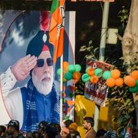 New Delhi, India - January 16 2023 - Prime Minister Narendra Modi cut out during BJP road show, the statue of PM Modi while attending a big election rally in the capital photo