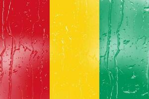 3D Flag of Guinea on a glass photo