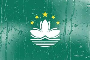 3d bandera de Macao en un vaso foto