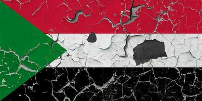 3D Flag of Sudan on an old stone wall background. photo