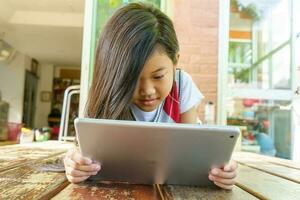 Children playing tablet photo