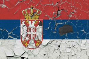 3D Flag of Serbia on an old stone wall background. photo