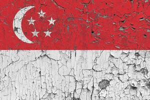 3D Flag of Singapore on an old stone wall background. photo