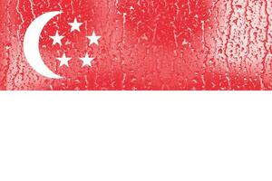 3D Flag of Singapore on a glass with water drop background. photo
