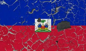 3D Flag of Haiti on an old stone wall background. photo