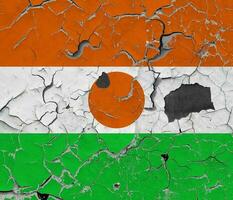 3D Flag of Niger on an old stone wall background. photo