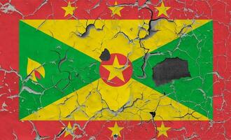 3D Flag of Grenada on an old stone wall background. photo