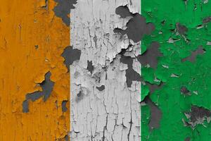 3D Flag of Ivory Coast on an old stone wall background. photo