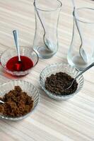 Ingredients of sundae dish as a part of non fire cooking which includes vanilla ice cream, brownie, coco powder, freshly chopped fruits and strawberry syrup. Preparation of sundae dish photo