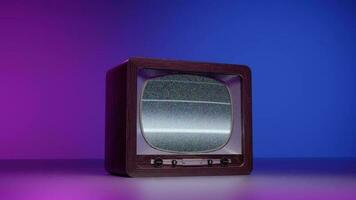 Retro TV with interference against neon illumination video