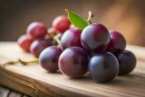 a pile of grapes on the rustic wood table display photo