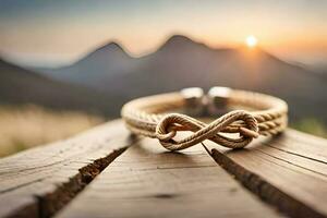 a close up photograph of a pair blue bracelet forming an infinity symbol on a rustic wood with bokeh background photo