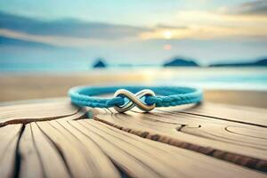 a close up photograph of a pair blue bracelet forming an infinity symbol on a rustic wood with bokeh background photo