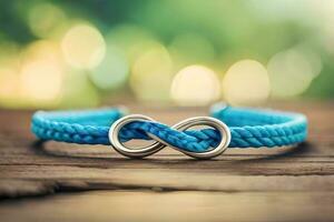 un cerca arriba fotografía de un par azul pulsera formando un infinito símbolo en un rústico madera con bokeh antecedentes foto