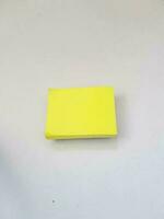 Isolated white photo of a yellow sticky note. These sticky notes look floating.