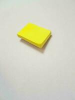 Isolated white photo of a yellow sticky note. These sticky notes look floating.