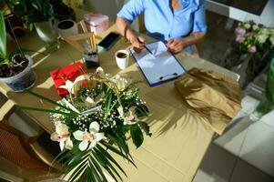 Top view workplace of a florist in design studio. photo