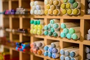 Close-up of watercolor markers and colored felt-tip pens on shelves in a school stationery shop. Office supply store photo