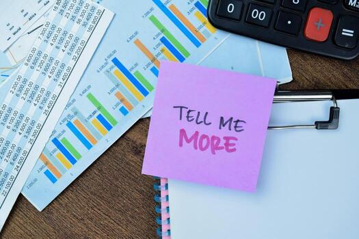 Concept of Tell Me More write on sticky notes isolated on Wooden Table. photo