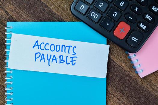 Concept of Accounts Payable write on sticky notes isolated on Wooden Table. photo
